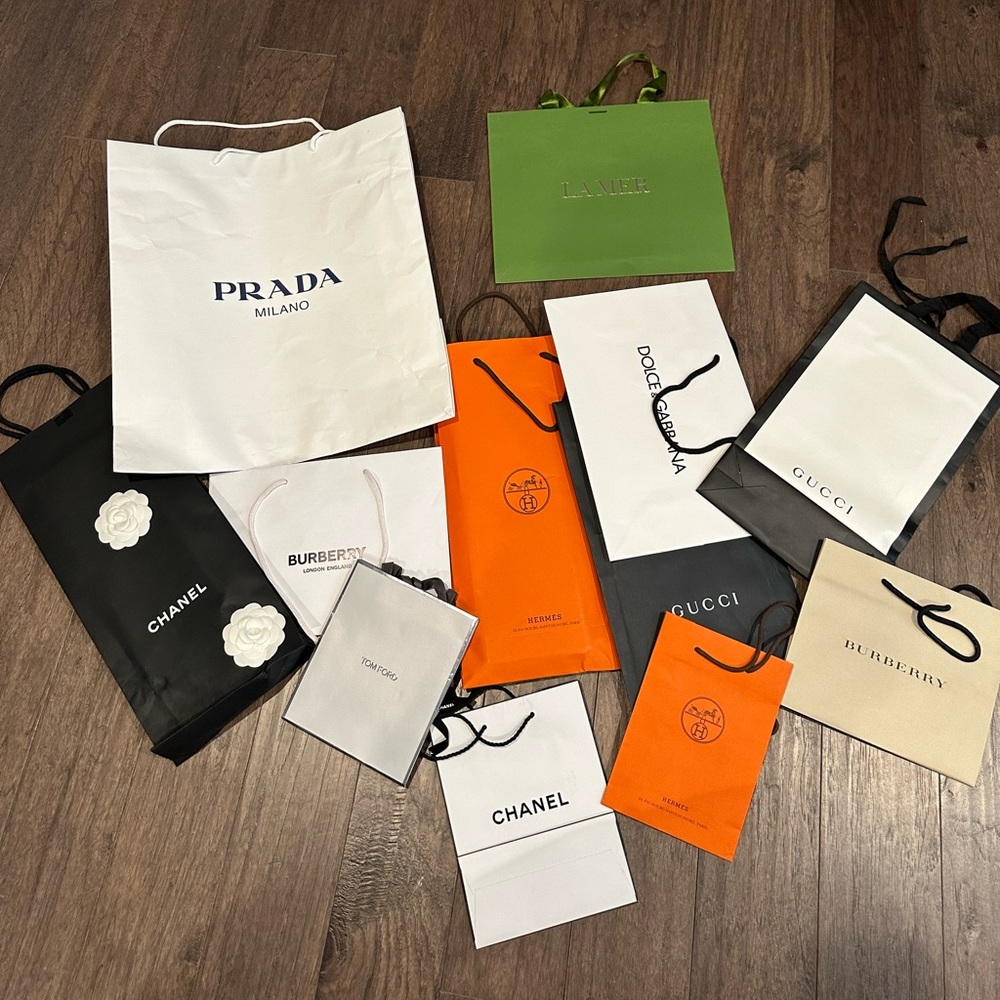 Chanel, hermes, Burberry, Tom Ford, Gucci, Prada, La mer Luxury shopping bags.
